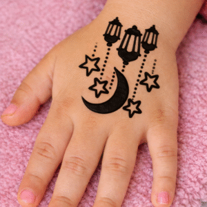 Kids henna design with crescent moon, stars, and hanging lanterns on a child’s hand.