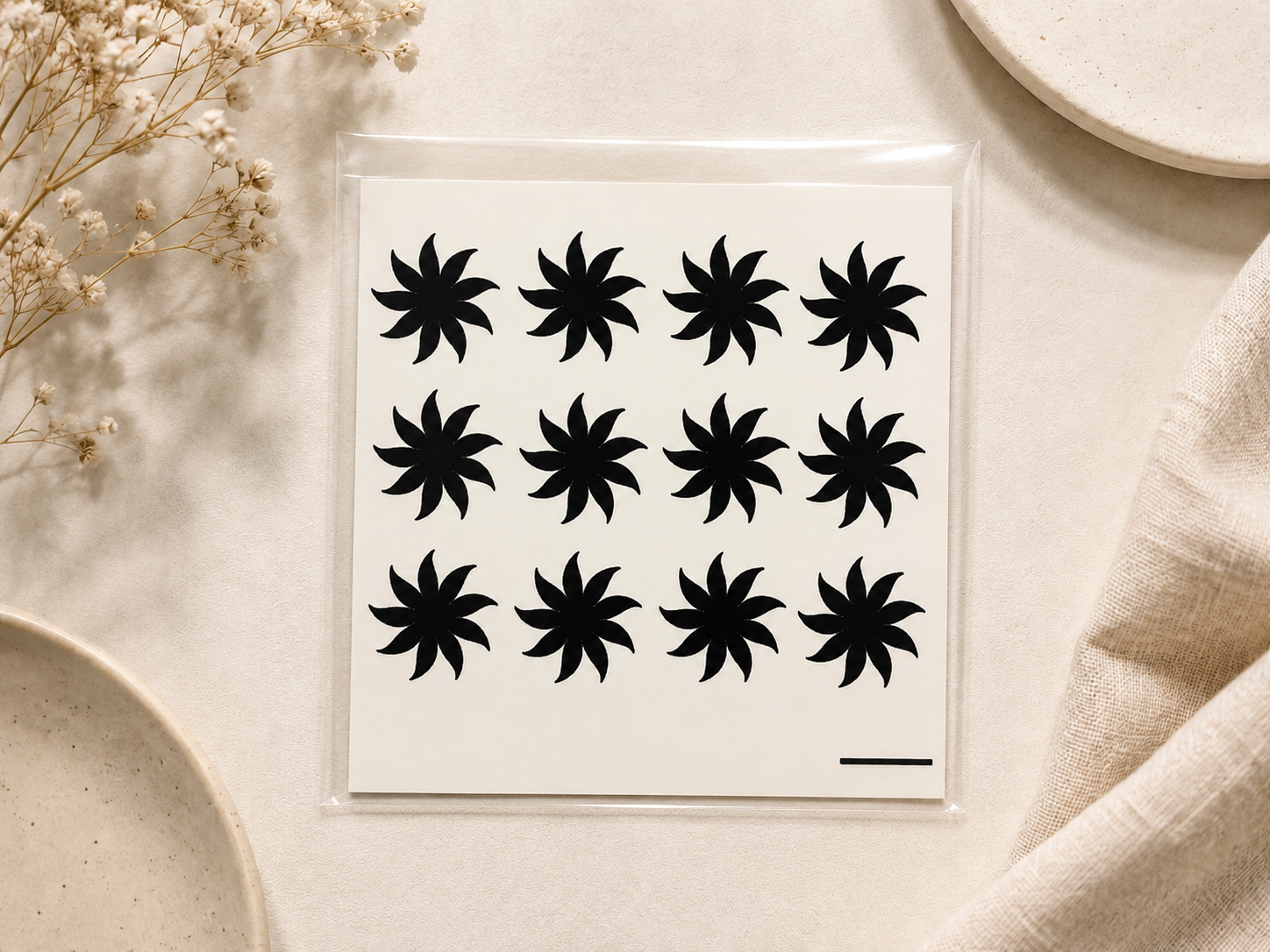 Black starburst temporary henna tattoo designs on 4x6 sheet