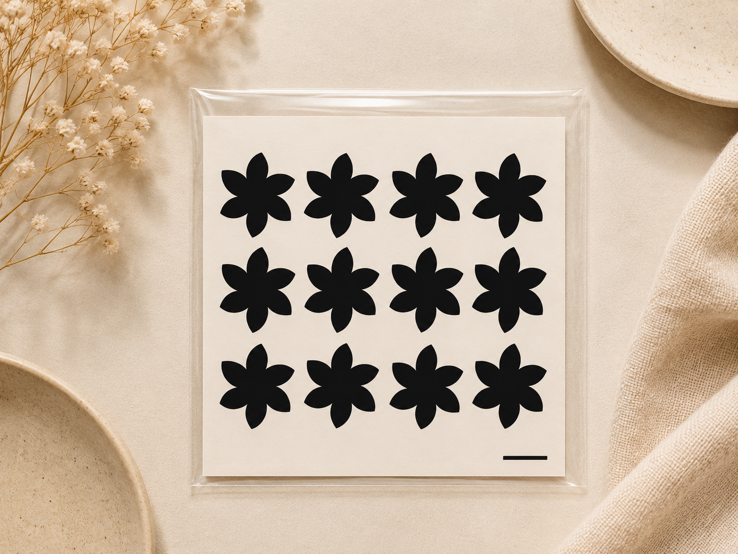 Small black floral temporary henna tattoo sheet with repeating flower designs